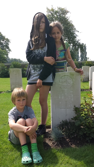 Ella, Lottie and Kai at Charles' grave in Ypres